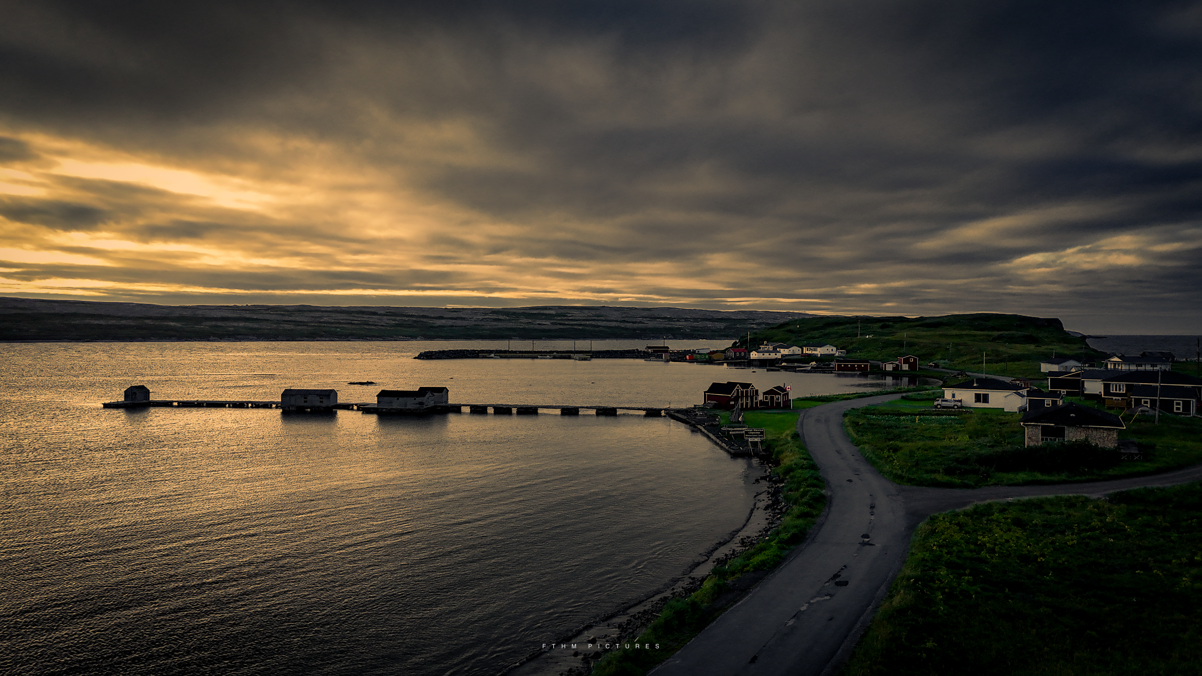 Aerial view of a coastal outport at sunset