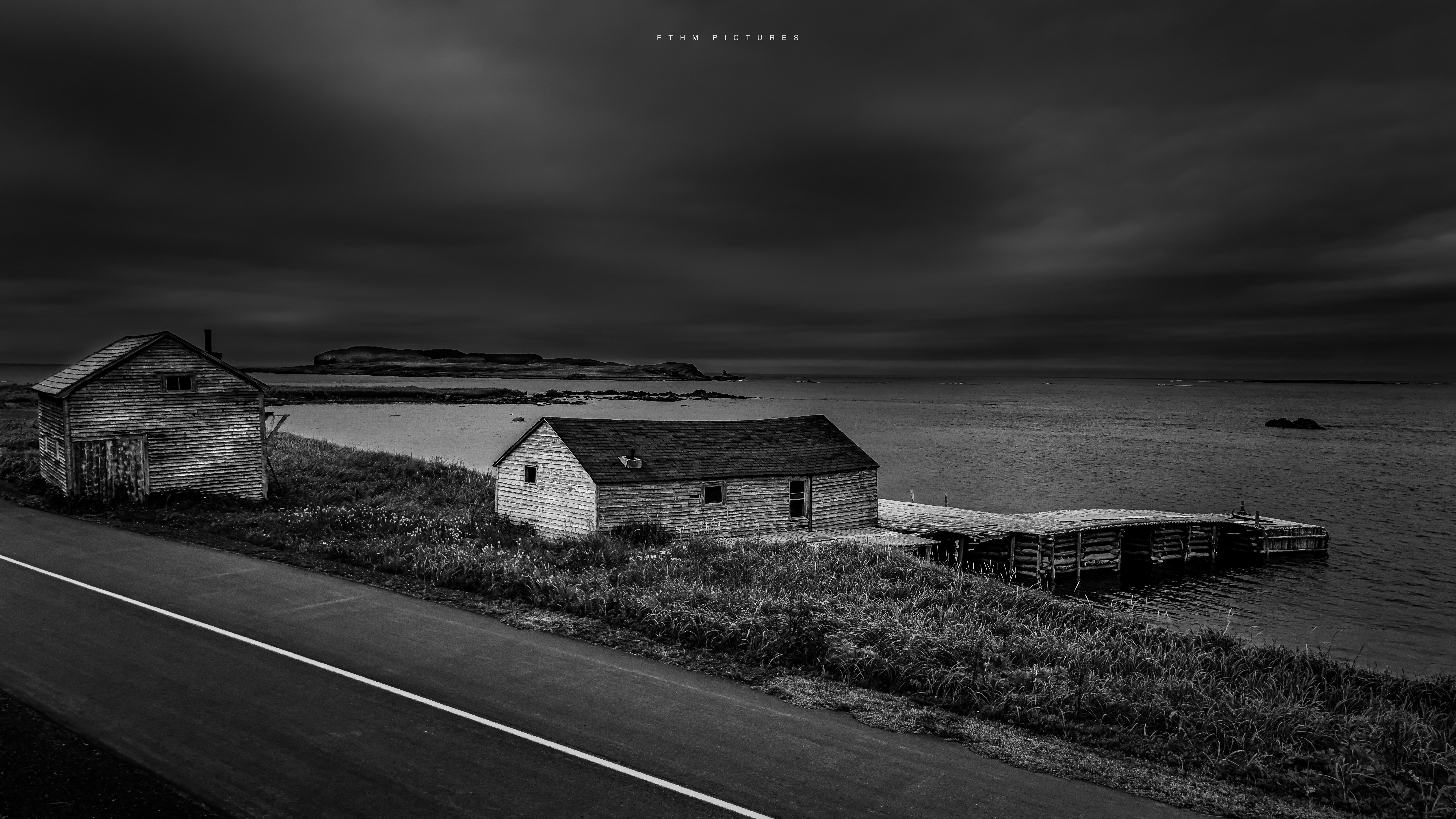 Black and white aerial photograph of an outport fishing community